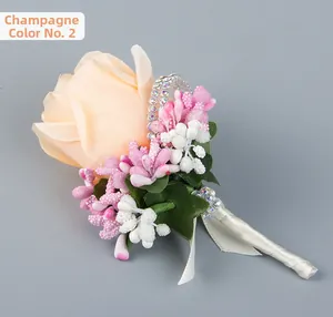 Close-up of champagne rose boutonniere with white ribbon handle and rhinestone detail