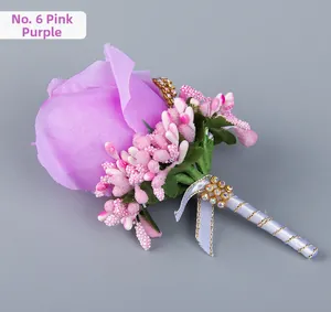 Close-up of pink-purple silk rose wedding boutonniere with berries and rhinestone detail