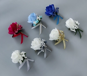 Detailed set of handmade artificial rose boutonnières in red, blue and white colors