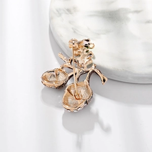 Golden hazelnut brooch with crystal accents showing the back pin mechanism and fine details