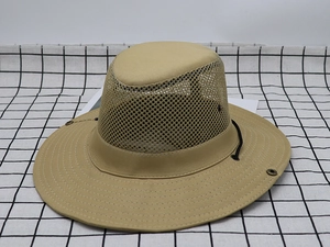 Detail of khaki outdoor sun hat featuring breathable mesh panels and durable canvas fabric