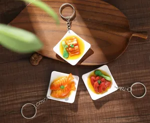 Detailed realistic mini Chinese food keychain models with red braised pork and fish