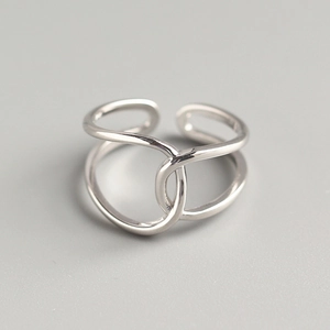 Detailed close-up of double-layered crisscross S925 sterling silver minimalist ring