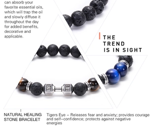 Detail of lava rock and tiger eye beads with silver barbell bead showing texture