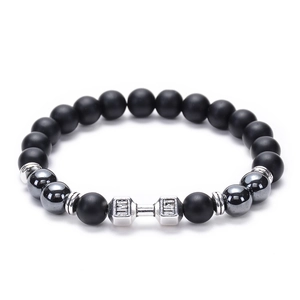 Macro shot of lava stone beads and silver barbell charm engraved with LIVE LIFT text