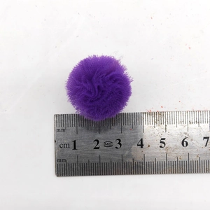 Purple mesh pet hair ball accessory with measuring ruler showing size at 3cm