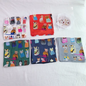Detail of five multi-colored 90cm silk scarves with diverse cat breed illustrations