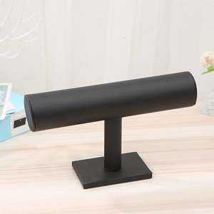 Detail of matte black T-bar jewelry stand with a stable base for bracelets and watches