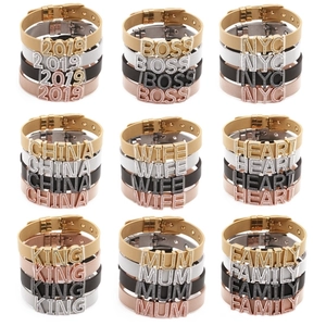 Detail of DIY stainless steel mesh bracelets with crystal letter charms in various finishes