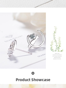 Detail of silver cat and moon stud earrings featuring sparkling round cubic zirconia