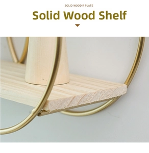 Close-up of solid wood board with golden circular metal frame for wall shelves