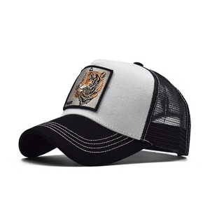 Detail of tiger embroidery patch on black and white mesh trucker baseball cap