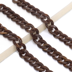 Close-up of brown acrylic eyeglasses chain with tortoiseshell pattern link detail