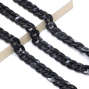 Close-up of black and white marble pattern acrylic eyeglass chain with chunky links