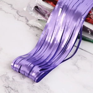 Close-up of purple matte foil fringe curtain background for birthday party decoration