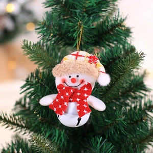 Cute snowman plush bell ornament with plaid hat hanging on a festive Christmas tree