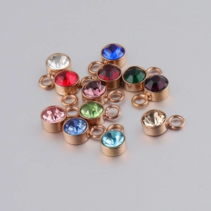 Collection of colorful stainless steel round birthstone charms with sparkling crystals