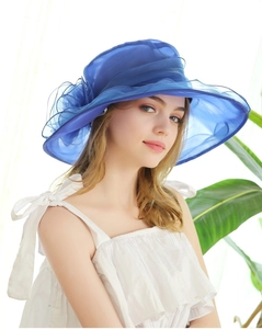 Close-up of deep blue organza sun hat featuring delicate 3D floral applique detailing