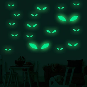 Luminous green eye stickers for Halloween wall decoration glowing in the dark