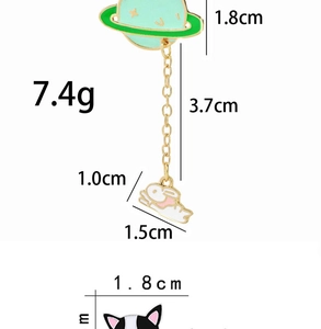 Detail view of enamel planet and rabbit pins with precise size and weight dimensions