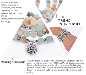 Macro detail of 108 mala beads bracelet with Amazonite stones and silver lotus charm