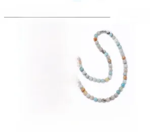 Detail of 8mm Amazonite 108 mala beads necklace featuring a lotus flower metal pendant