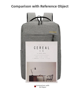 Waterproof business backpack size comparison against a standard magazine and A4 folder