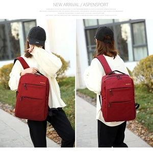Detail view of water-resistant business backpack featuring reinforced side carry handle