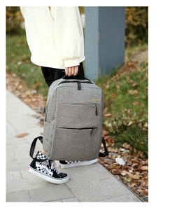 Detailed outdoor view of grey waterproof oxford business backpack with multi-pocket design