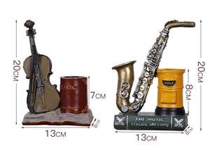 Detailed view of vintage musical instrument pen holders with saxophone and violin designs