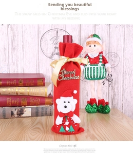 Detail of red wine bottle cover with 3D Merry Christmas text and bear design