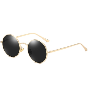 Retro round polarized sunglasses with golden metal frames and classic black lenses