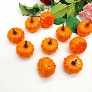 Detailed view of 5cm mini orange artificial foam pumpkins with realistic yellow spots