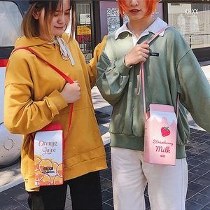 Creative milk box crossbody bag with unique cow print and stylish orange juice design