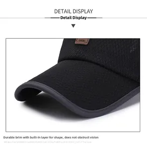 Detail of black mesh baseball cap with reinforced brim and leather patch accent