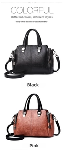 Close-up of black and pink soft leather tote bags with metal charms and dual straps