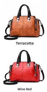 Detail of faux leather bags in tan and burgundy with pebbled texture and metal charms