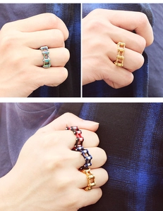 Detail of industrial chain ring showing mechanical texture and multicolor steel finish