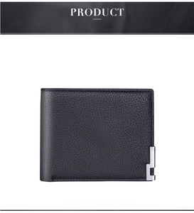Macro shot of black lychee grain leather wallet with silver metal corner protectors