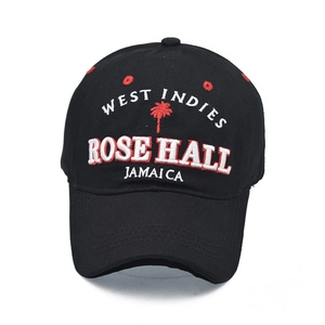 Close-up of 3D embroidery showing West Indies Rose Hall text and palm tree on black cotton cap