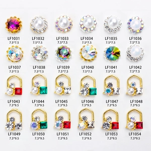 Detailed catalog of 24 alloy nail art charms with pearls, rhinestones and glass gems