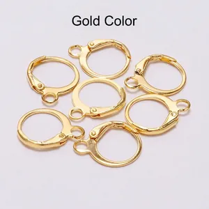 Close-up of golden lever-back earring hooks for DIY jewelry making findings