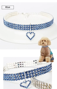 Detail of blue rhinestone pet collar with a heart pendant and adjustable lobster clasp chain
