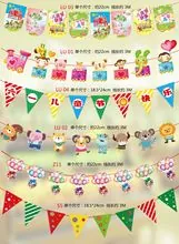 Various colorful party banners featuring cartoon forest animals, hot air balloons, and flags