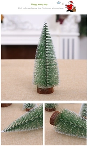 Close-up of mini snowy pine trees with white flocked needles and natural wooden bases
