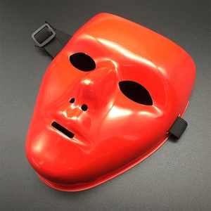 Detail view of red glossy performance mask with elastic band and smooth plastic texture