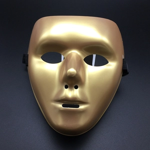Detailed studio shot of a gold full-face mask with metallic finish and elastic strap