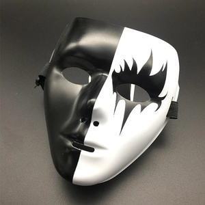 Detail of a bicolored black and white split mask with flame patterns and elastic band