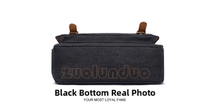 Detail view of the flat rectangular base of a black canvas business briefcase with neat stitching