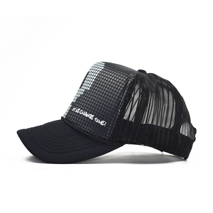 Black trucker hat with checkered print and 'IT IS CHANGE TIME' slogan in street style